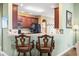 Breakfast bar with two stools in a well-lit kitchen at 569 Miromar Way, Myrtle Beach, SC 29588