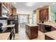 Modern kitchen with dark wood cabinets and granite countertops at 569 Miromar Way, Myrtle Beach, SC 29588