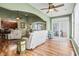 Bright living room featuring hardwood floors, comfortable seating, and access to sunroom at 569 Miromar Way, Myrtle Beach, SC 29588