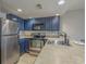 Modern kitchen with stainless steel appliances and blue cabinetry at 5905 South Kings Hwy. # 4205, Myrtle Beach, SC 29575