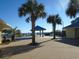 Beachfront deck with tables, chairs, and a gazebo at 601 Retreat Beach Circle # 128, Pawleys Island, SC 29585