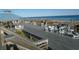 Elevated deck overlooking the beach with seating and ocean views at 601 Retreat Beach Circle # 128, Pawleys Island, SC 29585