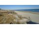 Expansive sandy beach with ocean waves and boardwalk access at 601 Retreat Beach Circle # 128, Pawleys Island, SC 29585