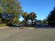 Gated entrance to a community with palm trees and landscaping at 601 Retreat Beach Circle # 128, Pawleys Island, SC 29585