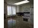 Kitchen with granite countertops and white cabinets at 601 Retreat Beach Circle # 128, Pawleys Island, SC 29585