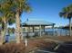 Scenic lakeside gazebo with rocking chairs and peaceful water views at 601 Retreat Beach Circle # 128, Pawleys Island, SC 29585