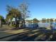 Gazebo with rocking chairs overlooking a peaceful lake at 601 Retreat Beach Circle # 128, Pawleys Island, SC 29585