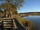 Calm waterway with lush vegetation and a wooden walkway at 601 Retreat Beach Circle # 128, Pawleys Island, SC 29585