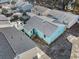 Aerial view of a teal house and surrounding neighborhood at 703 3Rd Ave. S, North Myrtle Beach, SC 29582