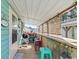 Relaxing covered deck with a grill and colorful stools at 703 3Rd Ave. S, North Myrtle Beach, SC 29582