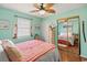 Light and airy bedroom with a mirrored closet and a queen bed at 703 3Rd Ave. S, North Myrtle Beach, SC 29582