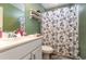 Clean bathroom with a shower/tub combo and floral shower curtain at 771 Flowering Branch Ave., Little River, SC 29566