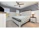 Charming bedroom with a unique striped wall and comfortable bed at 771 Flowering Branch Ave., Little River, SC 29566