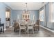 Charming dining room with a round table and chandelier at 771 Flowering Branch Ave., Little River, SC 29566