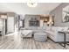 Bright living room, featuring an L-shaped sofa and ottoman at 771 Flowering Branch Ave., Little River, SC 29566