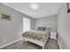 Simple bedroom with white bed frame and patterned bedding at 789 University Forest Circle, Conway, SC 29526