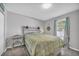 Cozy bedroom with a rustic wooden bed frame and light green bedding at 789 University Forest Circle, Conway, SC 29526