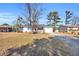 Single story home with a tree in the front yard and driveway at 789 University Forest Circle, Conway, SC 29526