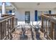 Front entrance with wooden steps and blue shutters at 789 University Forest Circle, Conway, SC 29526