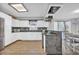 Open concept kitchen with white cabinets and granite countertops at 789 University Forest Circle, Conway, SC 29526