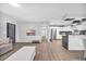 Open concept living room with view of kitchen and hallway at 789 University Forest Circle, Conway, SC 29526