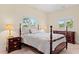 Spacious bedroom with a wooden bed frame and plenty of natural light at 8223 Forest Lake Dr., Conway, SC 29526