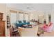 Relaxing living room featuring a teal sofa and hardwood floors at 8223 Forest Lake Dr., Conway, SC 29526