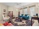 Cozy living room with teal sofa, area rug, and built-in shelving at 8223 Forest Lake Dr., Conway, SC 29526