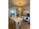 Bright dining area with white table and chairs at 8650 Southbridge Dr. # A, Surfside Beach, SC 29575