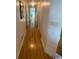 Long hallway with light hardwood floors at 8650 Southbridge Dr. # A, Surfside Beach, SC 29575