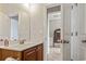 Bathroom with vanity, mirror, and view into another room at 912 Lorenzo Dr., North Myrtle Beach, SC 29582