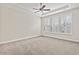 Bright bedroom with three windows and ceiling fan at 912 Lorenzo Dr., North Myrtle Beach, SC 29582