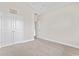 Well-lit bedroom featuring double doors and plush carpeting at 912 Lorenzo Dr., North Myrtle Beach, SC 29582