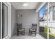 Relaxing screened porch with rocking chairs and ceiling fan at 912 Lorenzo Dr., North Myrtle Beach, SC 29582