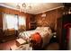 Cozy bedroom with a metal bed frame and wood floors at 916 Maple St., Mullins, SC 29574