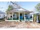 Charming white cottage with a spacious front porch at 916 Maple St., Mullins, SC 29574