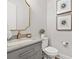 Elegant bathroom featuring a gray vanity and gold accents at 9387 Venezia Circle, Myrtle Beach, SC 29579