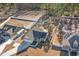 Aerial view of a neighborhood with several houses and empty lots at 9815 W Highway 19, Loris, SC 29569