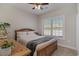 Bedroom with wooden bed frame and plenty of natural light at 9815 W Highway 19, Loris, SC 29569