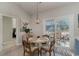 Cozy breakfast nook with white table, sliding glass doors and view of backyard at 9815 W Highway 19, Loris, SC 29569