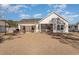 House exterior showcasing a backyard patio and firepit area at 9815 W Highway 19, Loris, SC 29569