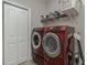 Laundry room with washer, dryer, and shelving for storage at 9815 W Highway 19, Loris, SC 29569