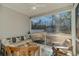 Screened porch with wooden furniture, providing backyard views at 9815 W Highway 19, Loris, SC 29569