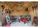 Interior view of a well-organized storage shed with various gardening tools at 9815 W Highway 19, Loris, SC 29569