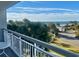 Balcony view of the ocean, beach, and palm trees at 9820 Queensway Blvd. # 206, Myrtle Beach, SC 29572