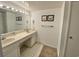 Clean bathroom with double vanity and a large mirror at 9820 Queensway Blvd. # 206, Myrtle Beach, SC 29572