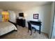 Bedroom with king-size bed, dresser, and a desk with chair at 9820 Queensway Blvd. # 206, Myrtle Beach, SC 29572