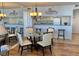 Dining area with round glass table and four chairs at 9820 Queensway Blvd. # 206, Myrtle Beach, SC 29572