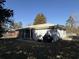 Home's back view showing a large backyard and grill area at 10 Buckthorn St., Andrews, SC 29510