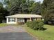Charming single-story home with a metal roof, brick accents, and well-maintained landscaping at 10 Buckthorn St., Andrews, SC 29510